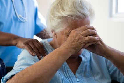 nurse-consoling-senior-woman-at-nursing-home-2023-11-27-05-23-29-utc